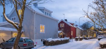 Sweden, Uppland, Stockholm County, Bromma, Car parked by house in residential district in winter 
